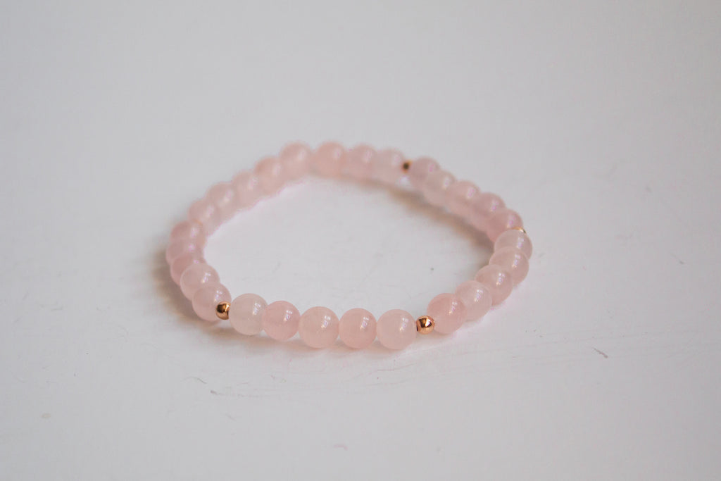 Mama’s Mini Collection stretch bracelet with AAA rose quartz beads and 14K rose gold filled beads, displayed on a white background.