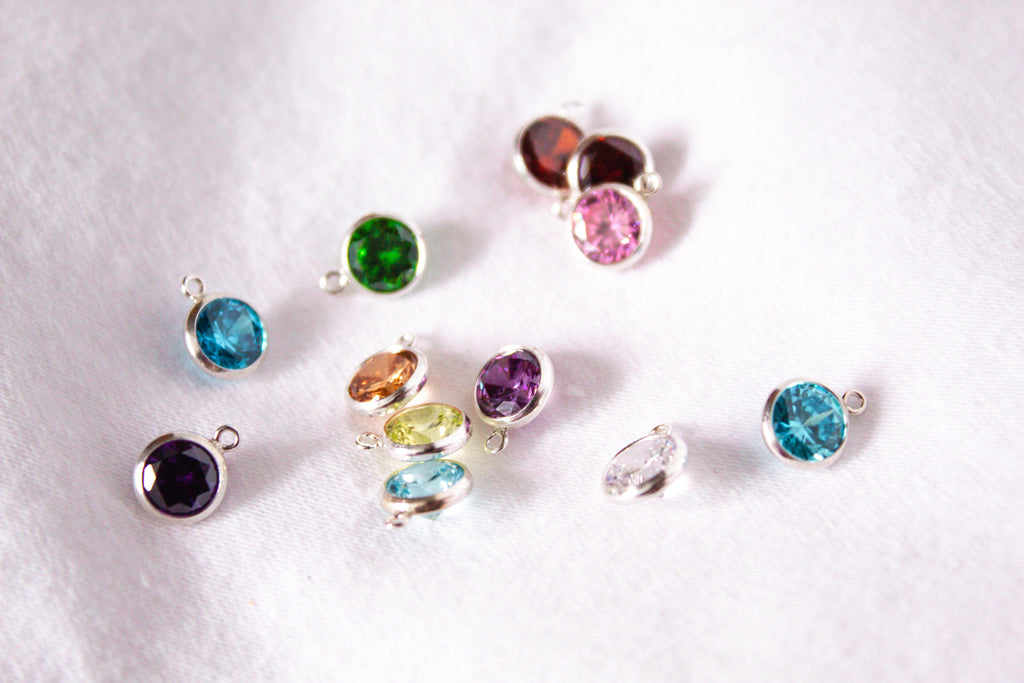 6mm birthstone charms, sitting on a white background