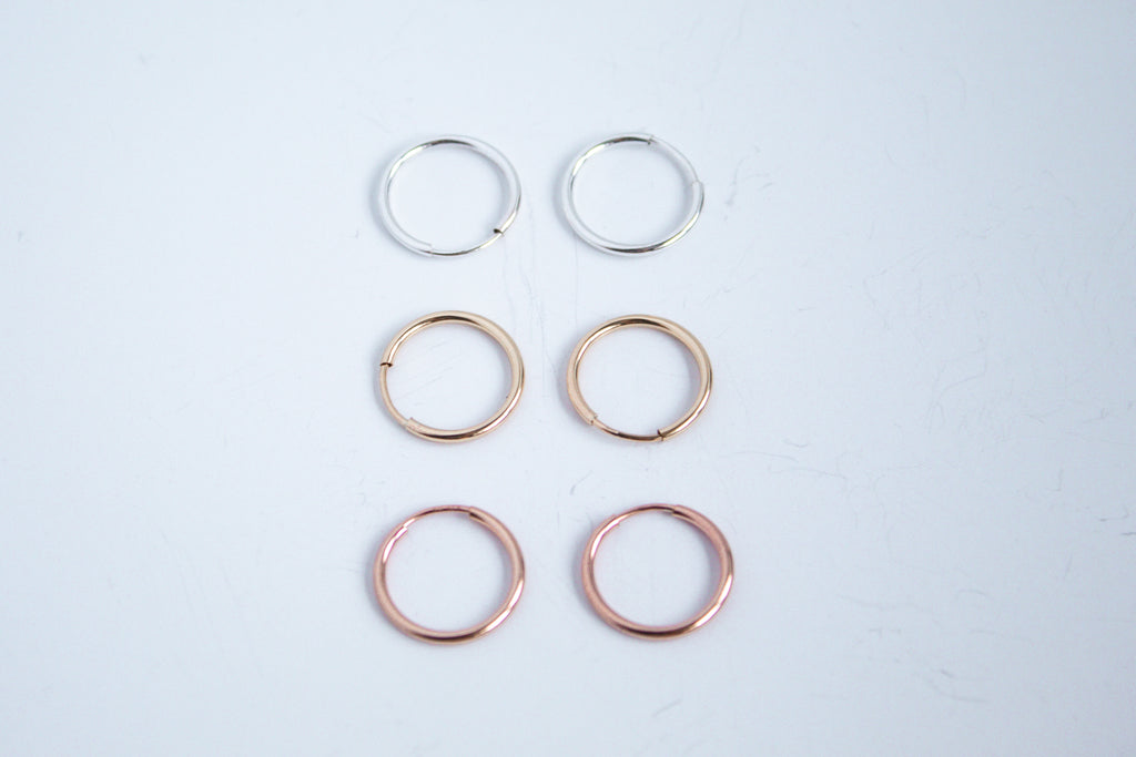 Always On Hoops in sterling silver, 14k gold filled and 14k rose gold filled displayed on a white background. 