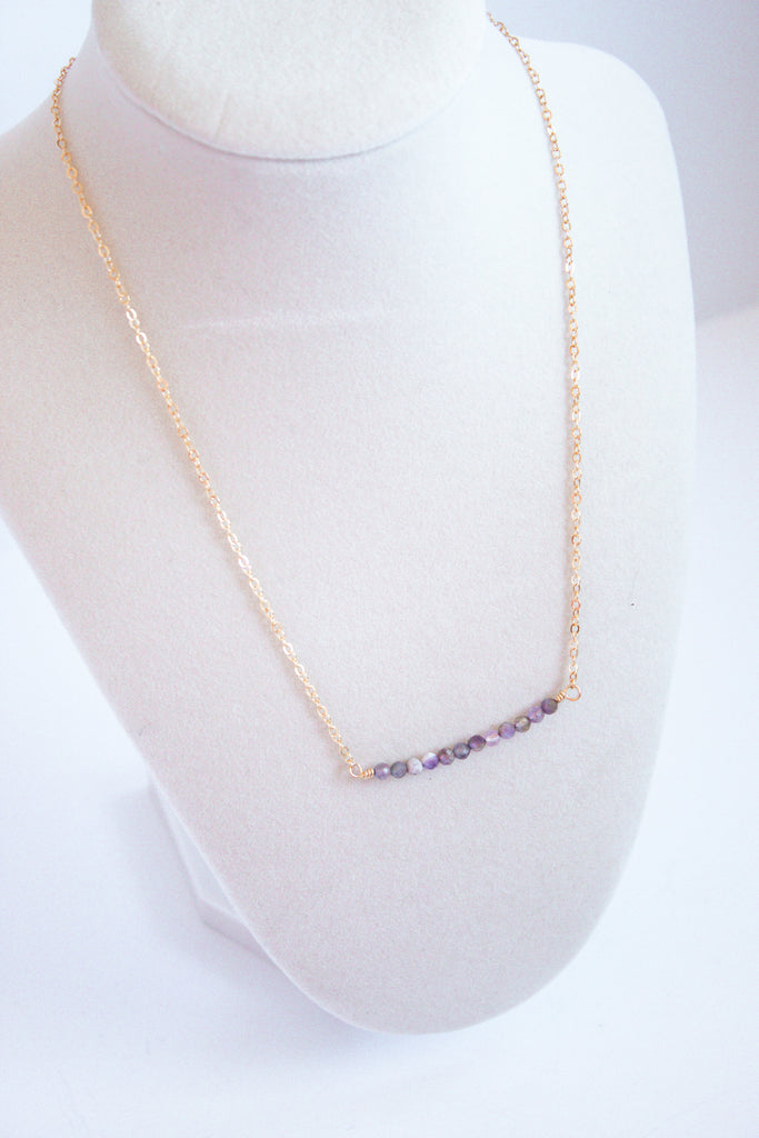 Moments and Milestone chain necklace with amethyst gemstone on a 14K gold-filled chain.