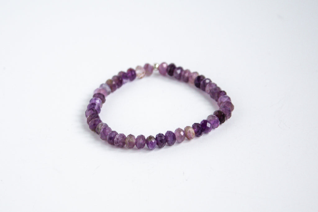 Fall collection gemstone stretch bracelet with amethyst beads, displayed on a clean white background.