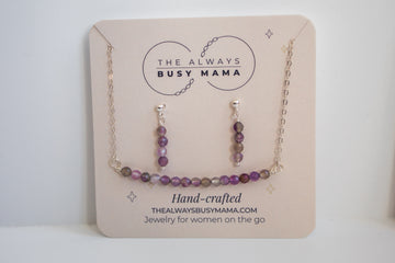 Moments and milestones amethyst stud earring and necklace set on a jewelry card. 