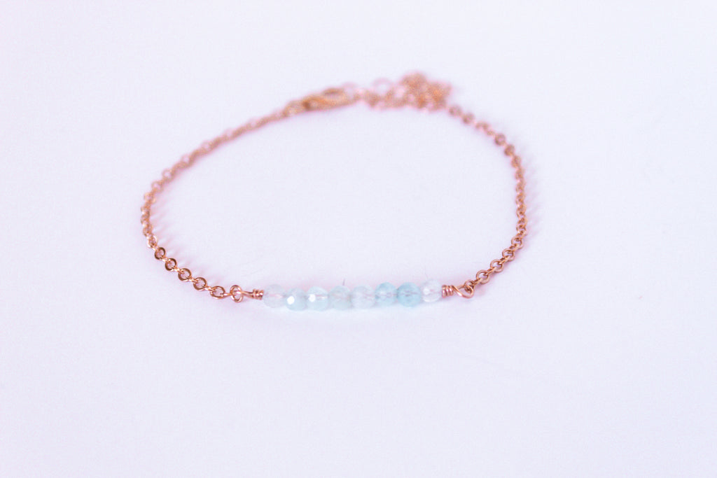 Moments and Milestone chain bracelet with aquamarine gemstones on a 14k rose gold filled chain.