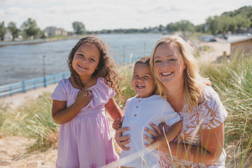 Becky and her kids on a dune while visiting family in grand haven Michigan. 