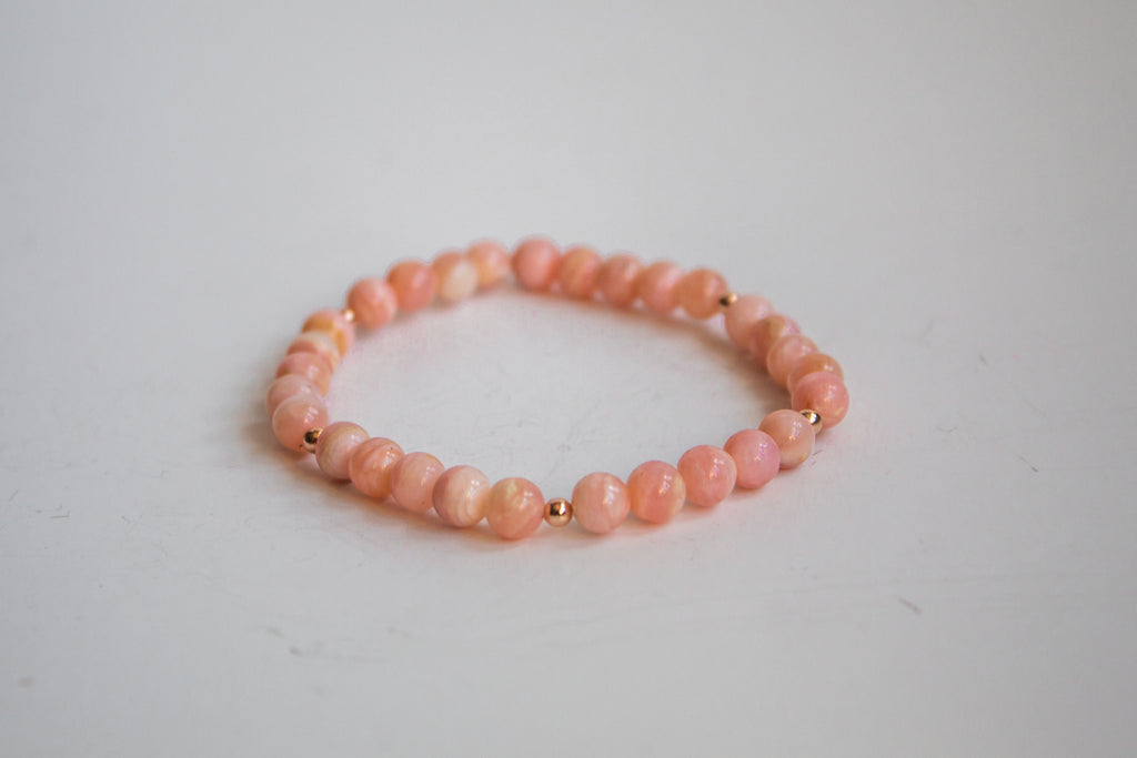 AAA Cherry Blossom gemstone bracelet with 14K rose gold filled from the Mama’s Mini Collection, laid flat against a white background.