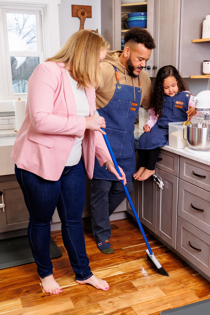 Becky, her husband, and Olivia are in the kitchen making cookies. 