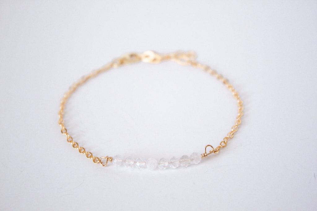 14k gold filled chain bracelet from the Moments and Milestone collection featuring faceted round clear quartz. 