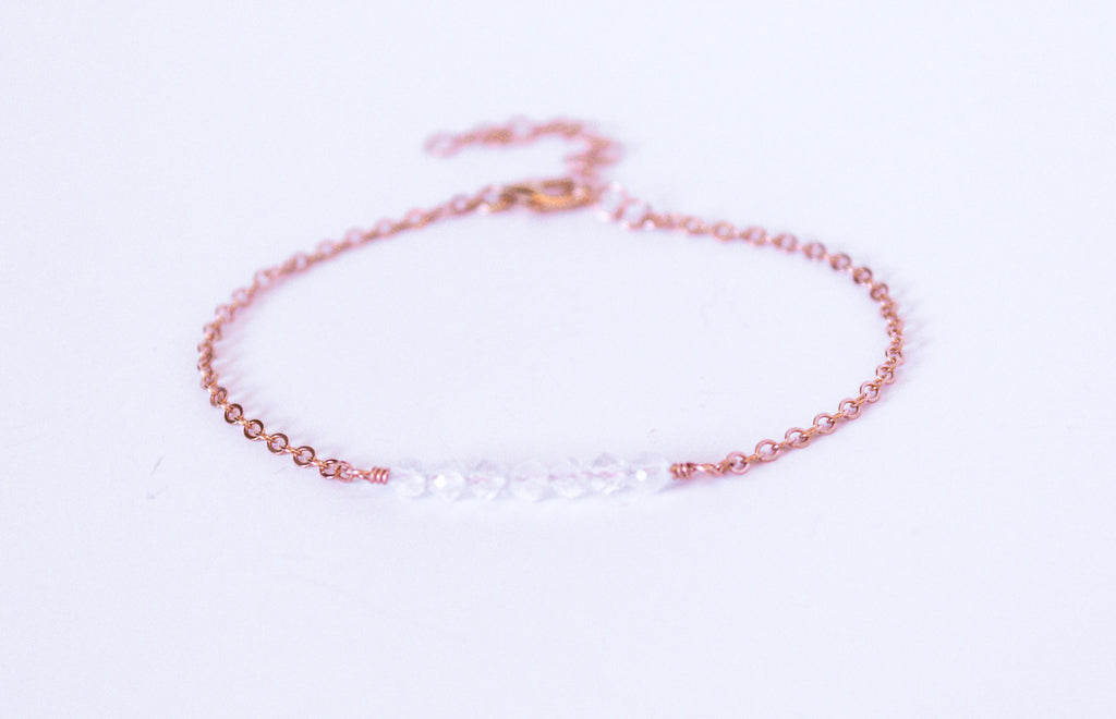 Moments and Milestone chain bracelet with clear quartz gemstones on a 14k rose gold filled chain.