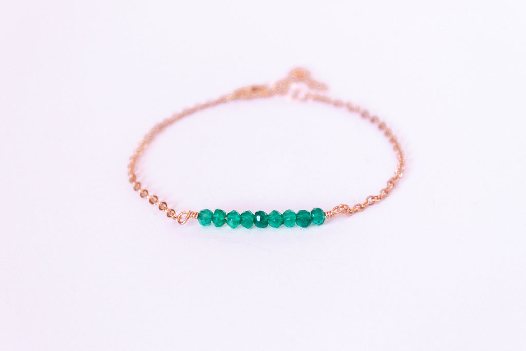 Moments and Milestone chain bracelet with emerald gemstones on a 14k rose gold filled chain.