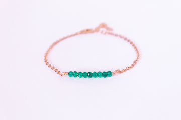 Moments and Milestone chain bracelet with emerald gemstones on a 14k rose gold filled chain.