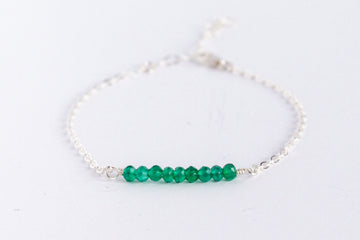 Moments and Milestone chain bracelet with emerald gemstones on a sterling silver chain.