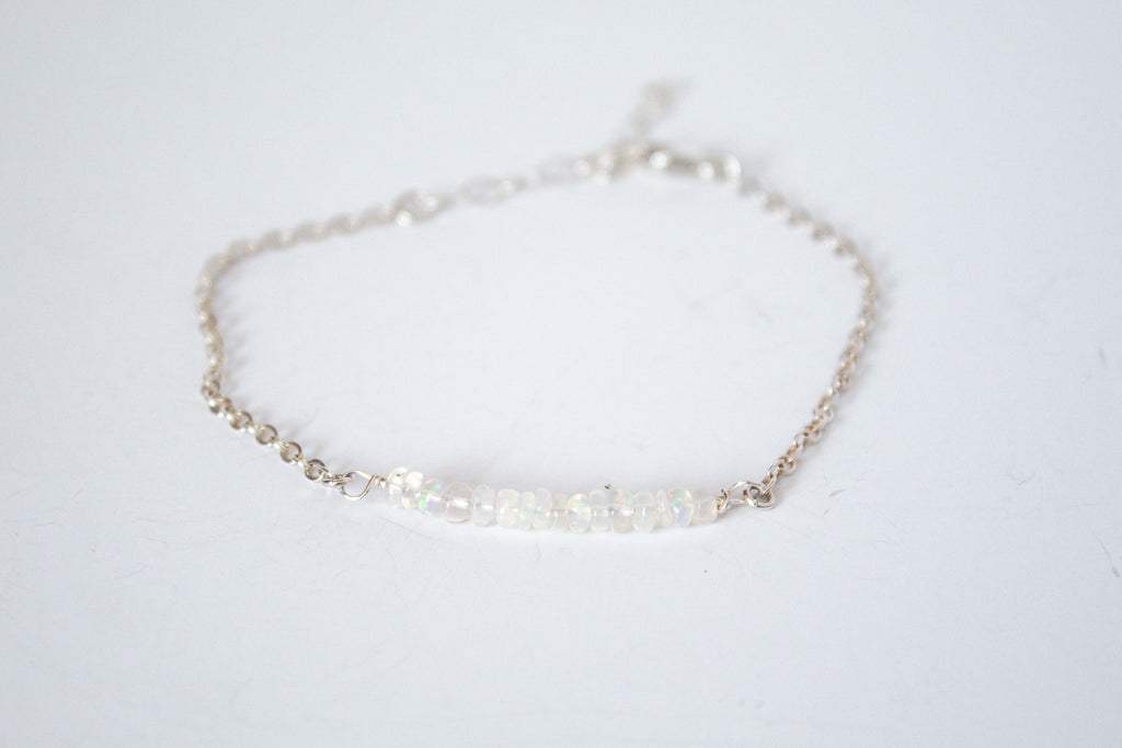 Moments and Milestone chain bracelet with fiery opal gemstones on a sterling silver chain.