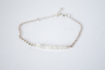 Moments and Milestone chain bracelet with fiery opal gemstones on a sterling silver chain.