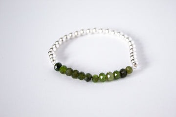 Handcrafted jade gemstone and sterling silver stretch bracelet from the Perfect Balance Collection, displayed on a white background.