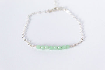 Sterling silver chain bracelet from the Moments and Milestone collection featuring faceted round jade gemstones.