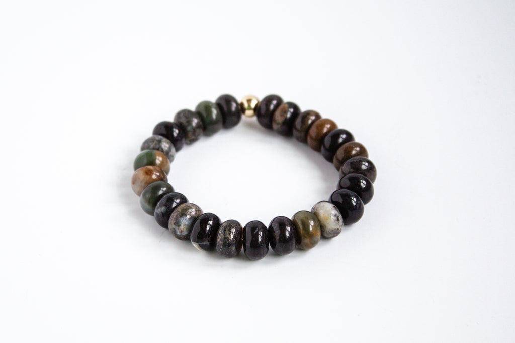 Mookaite gemstone with 14k gold filled accent bead stretch bracelet with earthy tones, showcased on a white background.