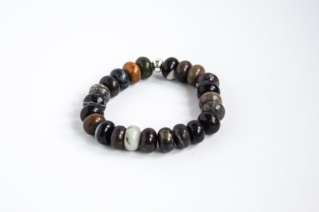 Mookaite gemstone stretch bracelet with earthy tones, showcased on a white background.