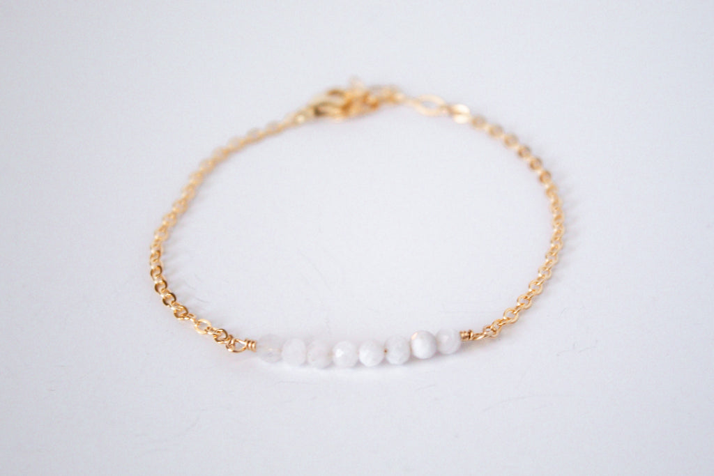 14k gold filled chain bracelet from the Moments and Milestone collection featuring faceted round moonstone gemstones.