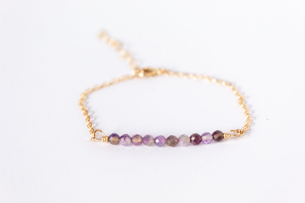 Moments and Milestone chain bracelet with multi amethyst gemstones on a 14k gold-filled chain.