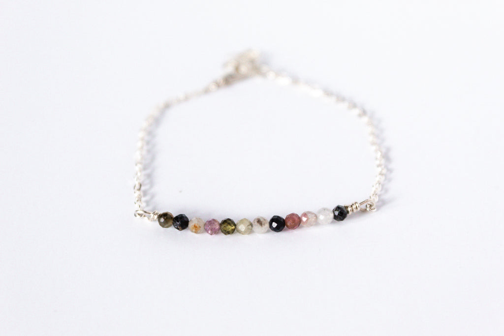 Sterling silver chain bracelet from the Moments and Milestone collection featuring faceted round watermelon tourmaline gemstones.