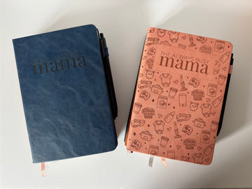 Notebooks in blue and tan on a white background