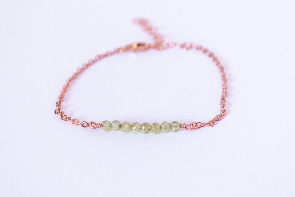 Moments and Milestone chain bracelet with peridot faceted round gemstone on a 14k gold filled chain.