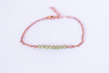 Moments and Milestone chain bracelet with peridot faceted round gemstone on a 14k gold filled chain.