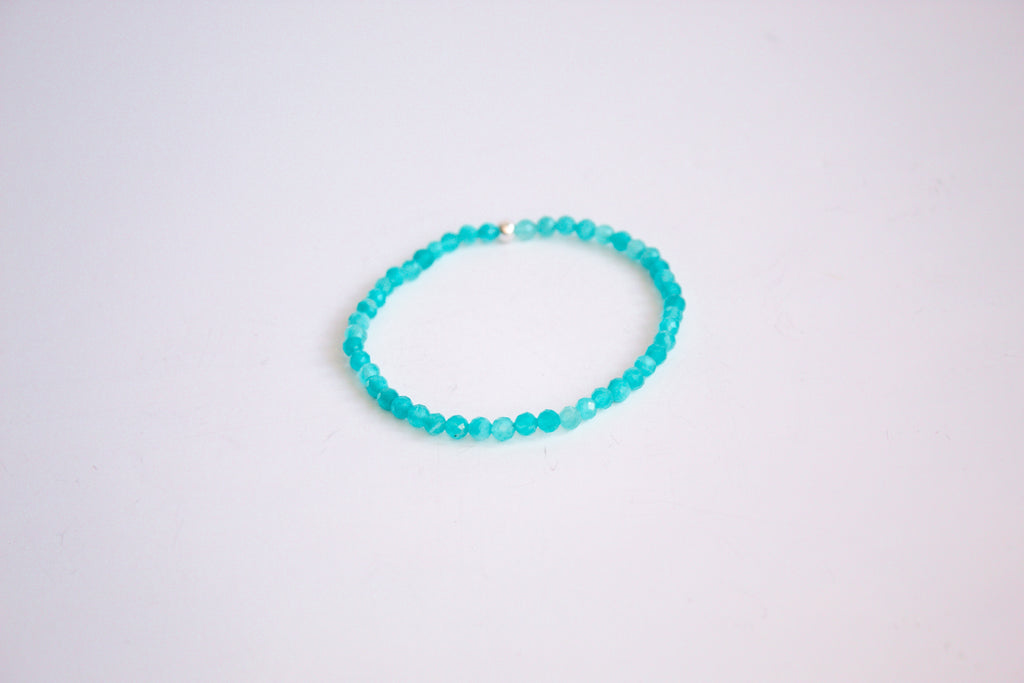 Peruvian Amazonite gemstone stretch bracelet from the mama's stretch bracelet collection, with one sterling silver bead, presented on a pure white background.