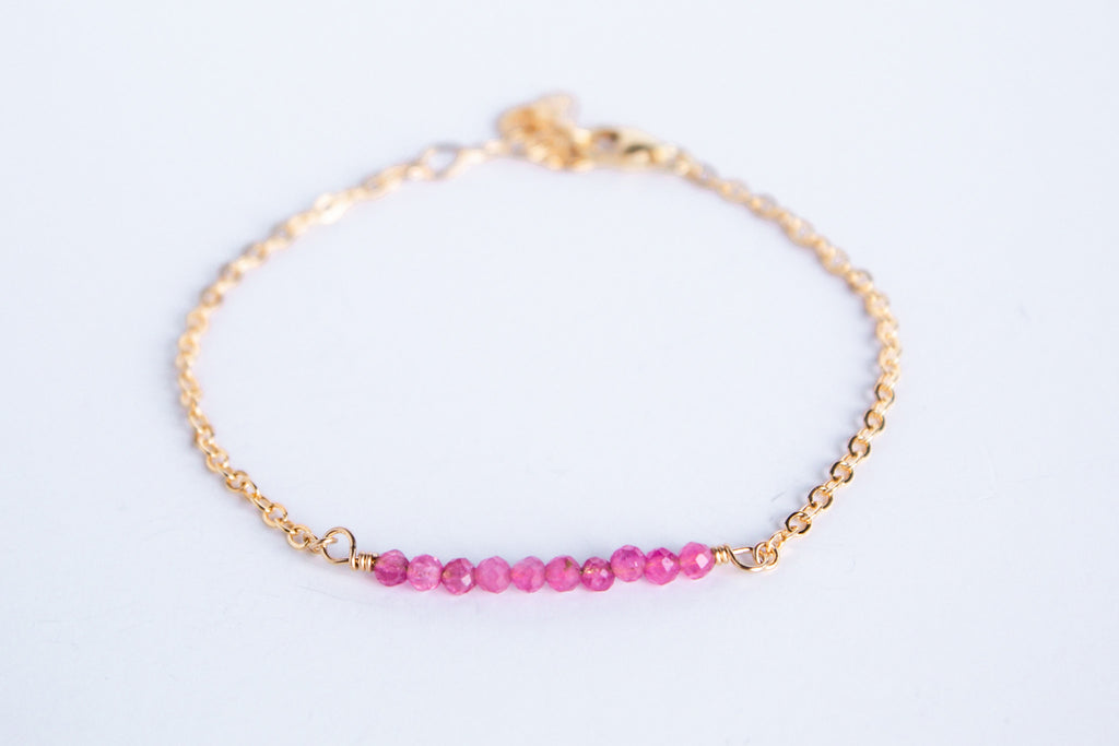 14k gold filled chain bracelet from the Moments and Milestone collection featuring faceted round pink tourmaline gemstones.