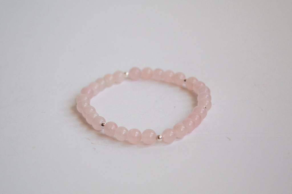 Mama’s Mini Collection stretch bracelet with AAA rose quartz beads, displayed on a white background.