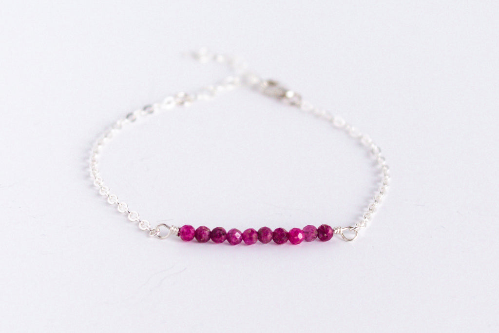 Moments and Milestone chain bracelet with ruby gemstones on a sterling silver chain.