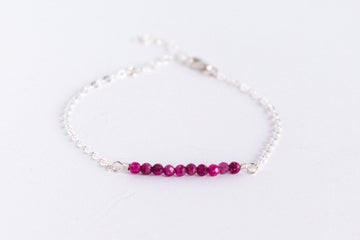 Moments and Milestone chain bracelet with ruby gemstones on a sterling silver chain.