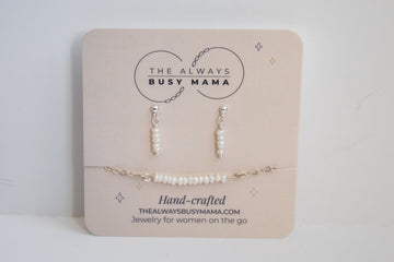 Moments and milestones small pearl stud earring and bracelet set in sterling silver on a jewelry card. 