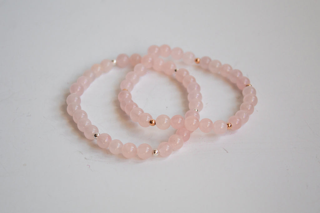 Mama’s Mini Collection stretch bracelets with AAA rose quartz beads and sterling silver and 14K rose gold filled accent beads, displayed on a white background.