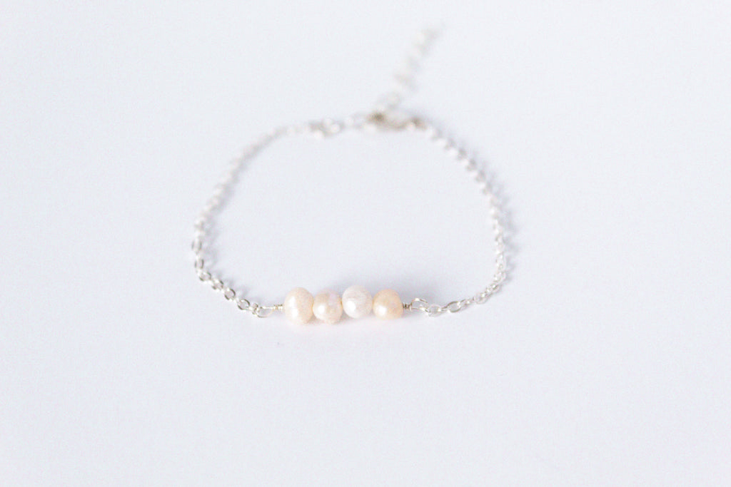 Sterling silver chain bracelet from the Moments and Milestone collection featuring 5mm pearls.