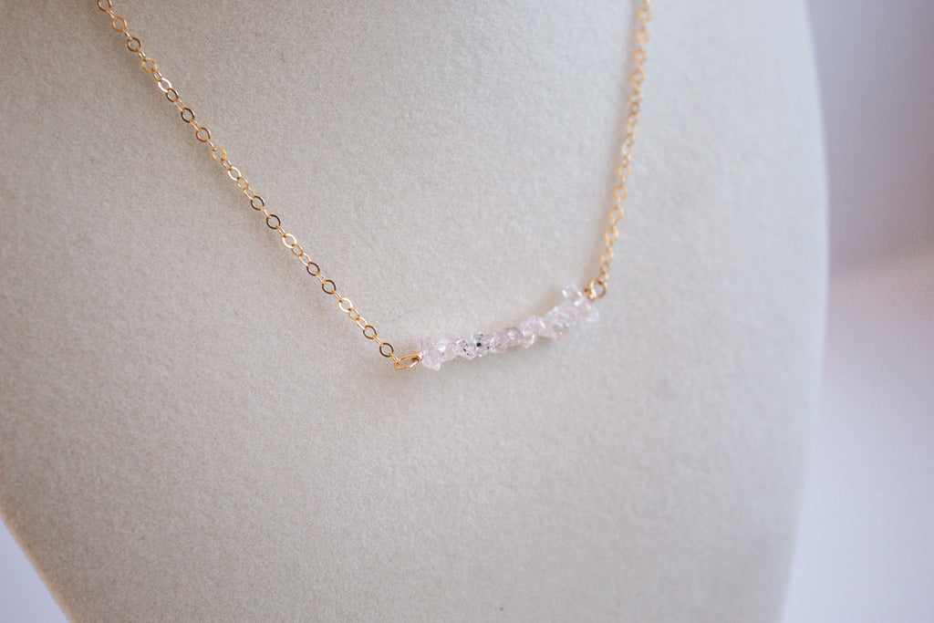 Close up Moments and Milestone chain necklace with herkimer diamond gemstone on a 14K gold-filled chain.