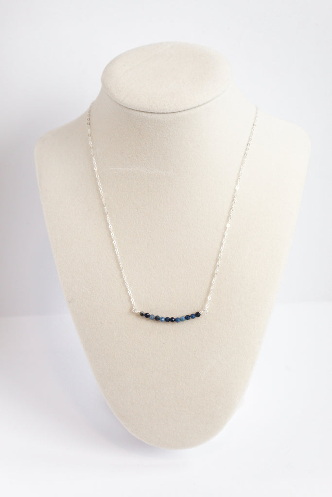 Moments and Milestone chain necklace with sapphire gemstone on a sterling silver chain.