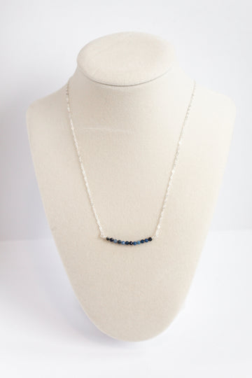 Moments and Milestone chain necklace with sapphire gemstone on a sterling silver chain.