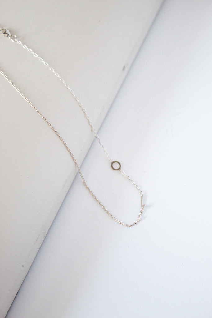 Sterling Silver sideways letter necklace, handcrafted in cheshire, CT displayed on a white background.